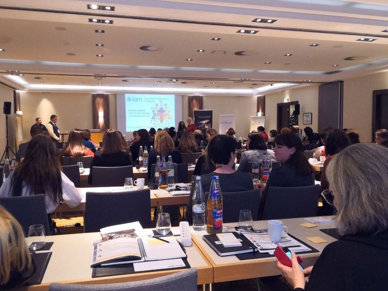A full room of delegates at an international IAM conference session